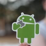 close up photo of a green android sticker