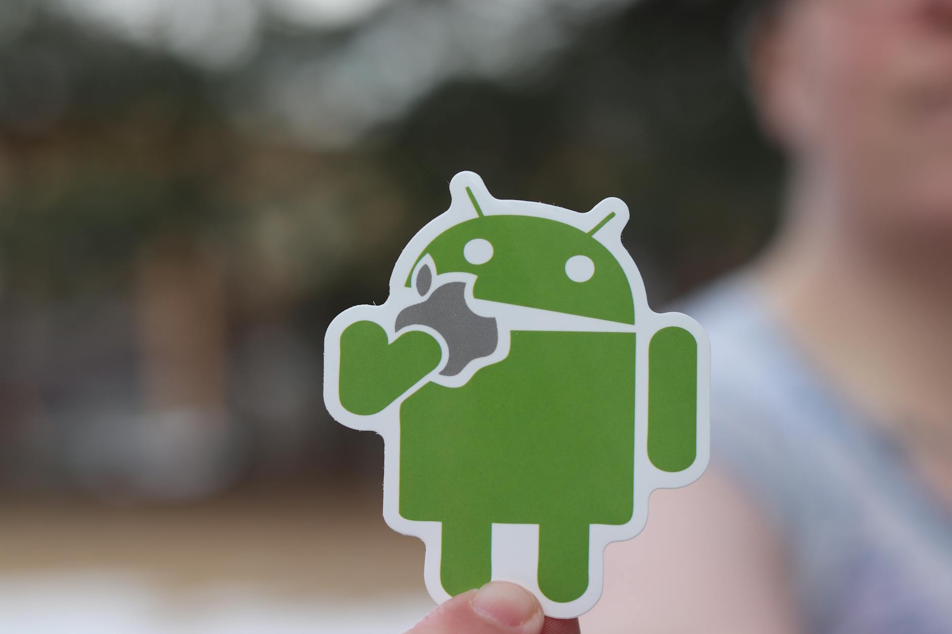 close up photo of a green android sticker